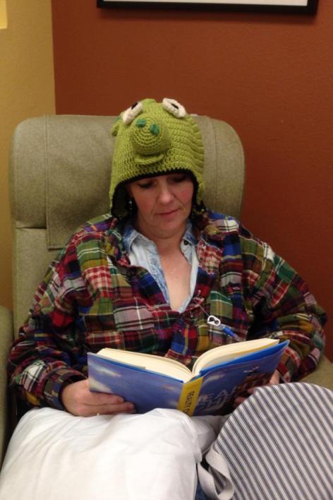 Nothing like a cozy pig hat, knit by Dale Roy, to keep you warm during a chemo treatment