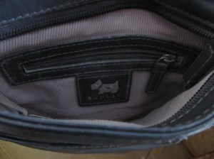 I have never even opened this inside zipper pocket where the cigarette and calling card were found.  Very impressive!