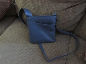 It says "London" on the outside and is leather.  it's not even black!